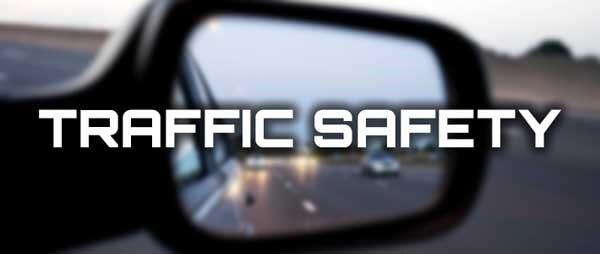 View from the passenger side mirror with text that says Traffic Safety