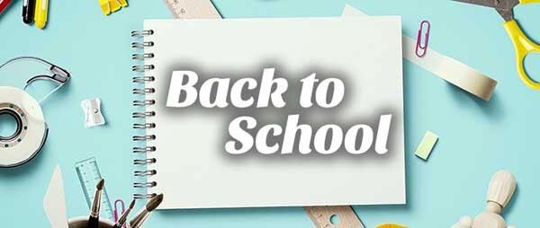 Back to School with a light blue background with tape, scissors and paper clips