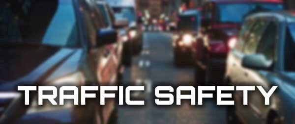 line of cars with white text saying Traffic Safety